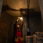 Builder handyman with construction tools. House renovation background