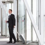 a-vertical-shot-of-a-businessman-pulling-suitcase-2025-10-15-05-03-30-utc